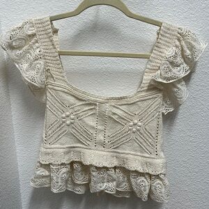 Never worn ruffle sleeve knit cropped tank. Perfect for beach vacations.